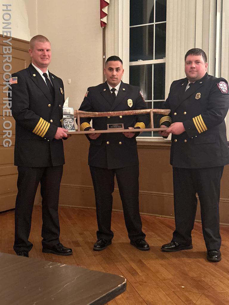 Past Fire Chief Jake Bailey received a commemorative axe for his years of serving in various leadership roles from Lieutenant to Fire Chief. 